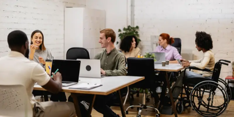 Professional web design team collaborating in an office